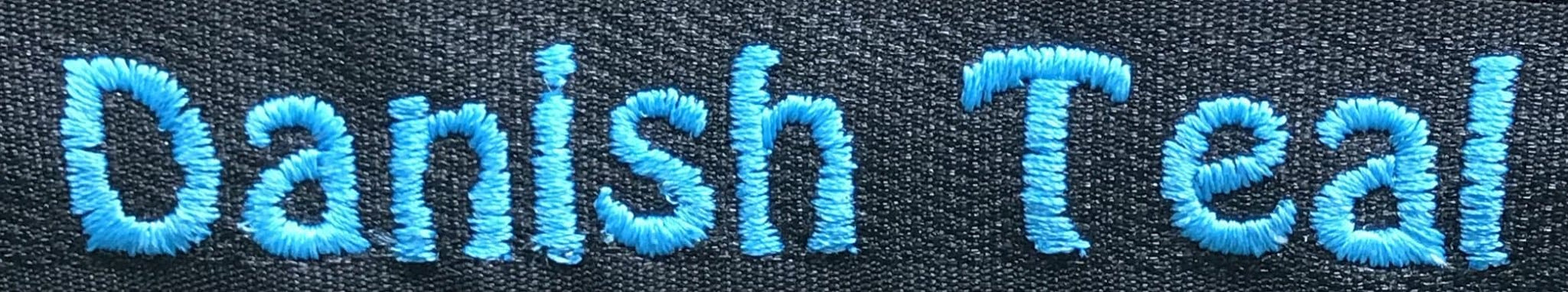 example of embroidery in Danish teal